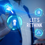 Word writing text Let S Rethink. Business concept for an Afterthought To Remember Reconsider Reevaluate Male human wear formal work suit presenting presentation using smart device.